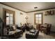 Cozy sitting area with comfortable armchairs and a wood barrel at 10947 E Wingspan Way, Scottsdale, AZ 85255