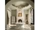 Primary bathroom with freestanding tub, fireplace, and French doors at 10947 E Wingspan Way, Scottsdale, AZ 85255