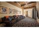 Home theater with comfortable seating and wood paneled walls at 10947 E Wingspan Way, Scottsdale, AZ 85255