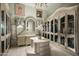 Elegant walk-in closet with ample storage and custom built-ins at 10947 E Wingspan Way, Scottsdale, AZ 85255