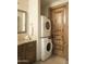 Convenient laundry room with stackable washer and dryer at 10947 E Wingspan Way, Scottsdale, AZ 85255