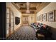Luxury home theater with plush seating and wood accents at 10947 E Wingspan Way, Scottsdale, AZ 85255