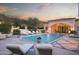 Luxury pool with lounge chairs and mountain backdrop at 10947 E Wingspan Way, Scottsdale, AZ 85255