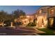 Grand estate entrance with fountain and landscaping at 10947 E Wingspan Way, Scottsdale, AZ 85255