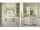 Spa-like bathroom with freestanding tub and dual vanities at 10947 E Wingspan Way, Scottsdale, AZ 85255