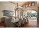 Formal dining room with large table and chandelier at 10947 E Wingspan Way, Scottsdale, AZ 85255