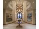 Stunning entryway with high ceilings and art at 10947 E Wingspan Way, Scottsdale, AZ 85255