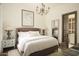 Charming bedroom with a comfortable queen-size bed and ensuite bathroom access at 10947 E Wingspan Way, Scottsdale, AZ 85255