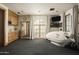 Bright fitness room with a Cryosauna and large windows at 10947 E Wingspan Way, Scottsdale, AZ 85255