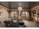 Relaxing game room with wet bar and access to outdoor patio at 10947 E Wingspan Way, Scottsdale, AZ 85255