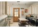 Bright laundry room with a large folding counter and modern appliances at 10947 E Wingspan Way, Scottsdale, AZ 85255