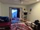 Bedroom with sliding glass doors that lead to the back patio at 10038 W Lancaster Dr, Sun City, AZ 85351