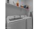 Bright laundry room, features Samsung washer and dryer, and ample storage at 21003 E Estrella Rd, Queen Creek, AZ 85142