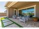 Covered patio with view into the living room at 5549 S Del Rancho --, Mesa, AZ 85212