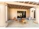 Relaxing patio featuring a covered seating area with comfortable chairs and a small table at 8638 E Paraiso Dr, Scottsdale, AZ 85255