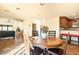 Dining area with wooden table and chairs, open to living area at 8638 E Paraiso Dr, Scottsdale, AZ 85255