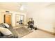 Spacious office featuring a mirrored closet, desk, and comfortable couch at 8638 E Paraiso Dr, Scottsdale, AZ 85255