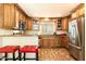 Modern kitchen with stainless steel appliances and wood cabinets at 8638 E Paraiso Dr, Scottsdale, AZ 85255