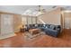 Comfortable living room with large sectional sofa and wood floors at 11596 W Sierra Dawn Blvd # 377, Surprise, AZ 85378