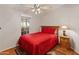 Bedroom with red bedding and ceiling fan at 11596 W Sierra Dawn Blvd # 377, Surprise, AZ 85378