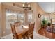 Bright dining room with a wooden table, chairs, and a chandelier at 11596 W Sierra Dawn Blvd # 377, Surprise, AZ 85378