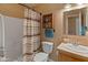 Bathroom with shower, toilet and striped curtain at 11596 W Sierra Dawn Blvd # 377, Surprise, AZ 85378