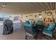 Covered patio with seating area and grill, great for entertaining at 11596 W Sierra Dawn Blvd # 377, Surprise, AZ 85378