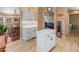 Kitchen features white cabinets, an island, and a view into the dining area at 11596 W Sierra Dawn Blvd # 377, Surprise, AZ 85378