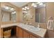 Bathroom with double sinks and a large mirror at 11596 W Sierra Dawn Blvd # 377, Surprise, AZ 85378