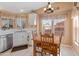 Kitchen nook with a wooden table and chairs, offering ample sunlight at 11596 W Sierra Dawn Blvd # 377, Surprise, AZ 85378
