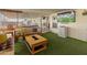 Relaxing sunroom with artificial turf flooring and TV at 11596 W Sierra Dawn Blvd # 377, Surprise, AZ 85378