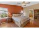 Main bedroom with wood flooring and ensuite bathroom access at 11596 W Sierra Dawn Blvd # 377, Surprise, AZ 85378