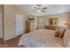 Spacious bedroom with wood furniture and a ceiling fan at 11596 W Sierra Dawn Blvd # 377, Surprise, AZ 85378