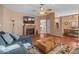 Living room with sectional sofa, fireplace, and view of kitchen at 11596 W Sierra Dawn Blvd # 377, Surprise, AZ 85378