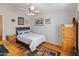 Bedroom with a bed, dresser, and ceiling fan at 11596 W Sierra Dawn Blvd # 377, Surprise, AZ 85378