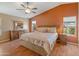 Large main bedroom with a king-size bed, ceiling fan and wood furniture at 11596 W Sierra Dawn Blvd # 377, Surprise, AZ 85378
