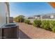 Side yard with gravel, shrubs, and AC unit at 11596 W Sierra Dawn Blvd # 377, Surprise, AZ 85378