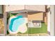 An aerial view of a kidney-shaped pool and patio at 11532 W Piccadilly Rd, Avondale, AZ 85392