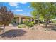 Backyard view of home with covered patio and landscaping at 22527 N Arrellaga Dr, Sun City West, AZ 85375