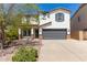Two-story home with a welcoming front yard and attached garage at 4882 E Amarillo Dr, San Tan Valley, AZ 85140