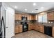 Modern kitchen featuring granite countertops and stainless steel appliances at 4882 E Amarillo Dr, San Tan Valley, AZ 85140