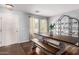 Bright dining area with wood table, bench, and decorative shelving at 4882 E Amarillo Dr, San Tan Valley, AZ 85140