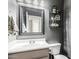 Clean bathroom with modern vanity and decorative mirror at 4882 E Amarillo Dr, San Tan Valley, AZ 85140