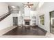 Two-story living room with a fireplace and hardwood floors at 15029 W Minnezona Ave, Goodyear, AZ 85395