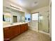 Bathroom with double vanity, soaking tub, and shower at 36085 W Catalan St, Maricopa, AZ 85138