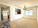 Open dining room with neutral carpeting and a chandelier at 36085 W Catalan St, Maricopa, AZ 85138