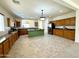 Open concept kitchen with island and ample cabinet space at 36085 W Catalan St, Maricopa, AZ 85138