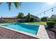 Inviting backyard oasis with a sparkling pool and patio at 18658 N Tanners Way, Maricopa, AZ 85138