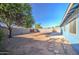 Backyard with gravel, block wall, and patio area at 320 W Nopal Pl, Chandler, AZ 85224