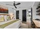 Bedroom with built-in workspace and ensuite bathroom at 39115 N 99Th Pl, Scottsdale, AZ 85262